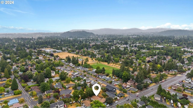 birds eye view of property featuring a mountain view