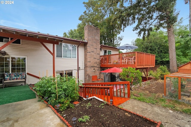 exterior space featuring a wooden deck