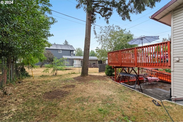 view of yard featuring a wooden deck