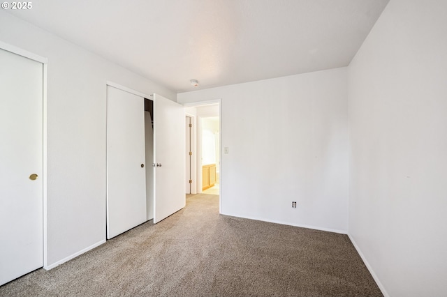 unfurnished bedroom featuring light colored carpet