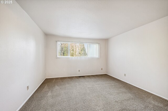 unfurnished room featuring carpet floors