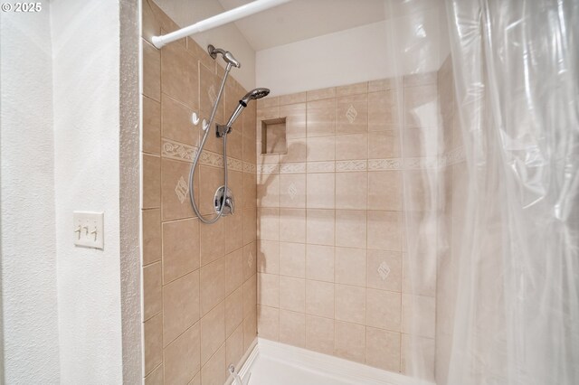 bathroom with a shower with shower curtain