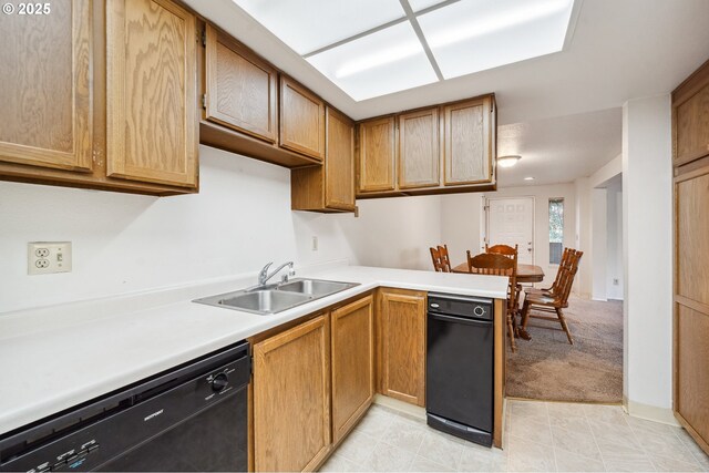 kitchen featuring light carpet, sink, kitchen peninsula, and dishwasher