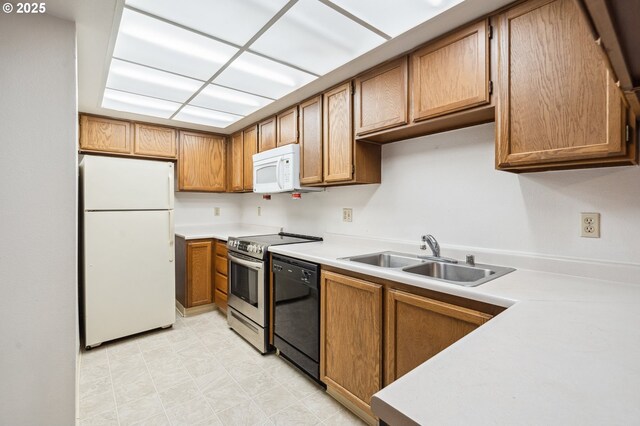 kitchen featuring sink and white appliances