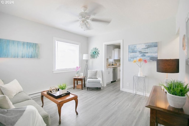 living room featuring light wood-type flooring and ceiling fan