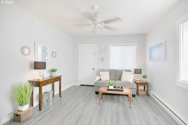 living room with plenty of natural light and light wood finished floors