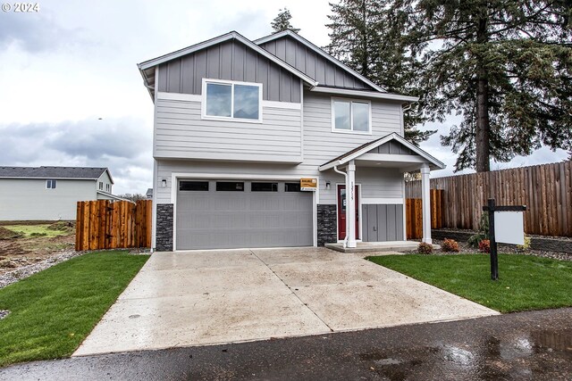 view of front facade featuring a garage and a front lawn