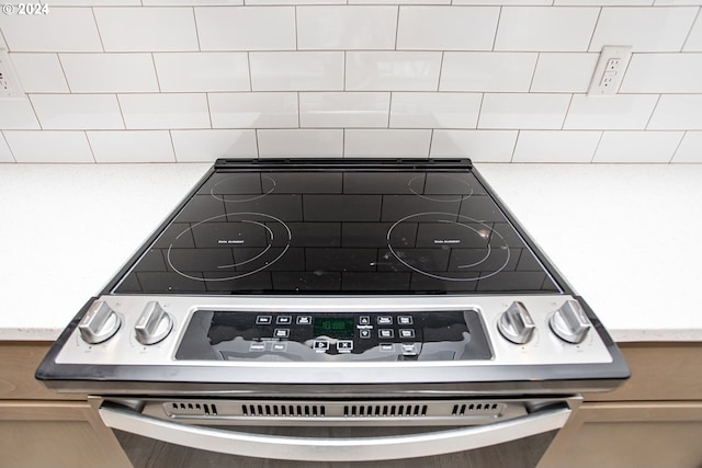 interior details featuring stainless steel electric stove