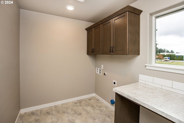 laundry area with washer hookup, cabinets, and hookup for an electric dryer