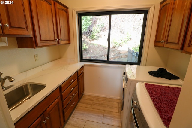 kitchen with sink and washer and clothes dryer