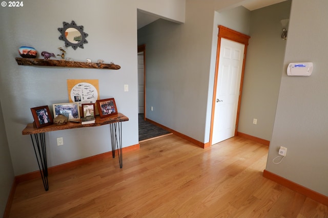 hall with light wood-type flooring