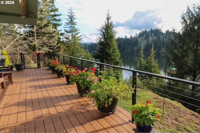 wooden deck with a water view