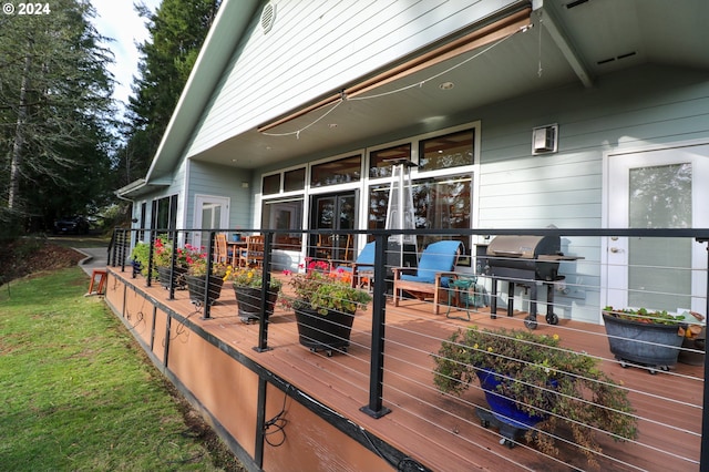 wooden deck featuring grilling area