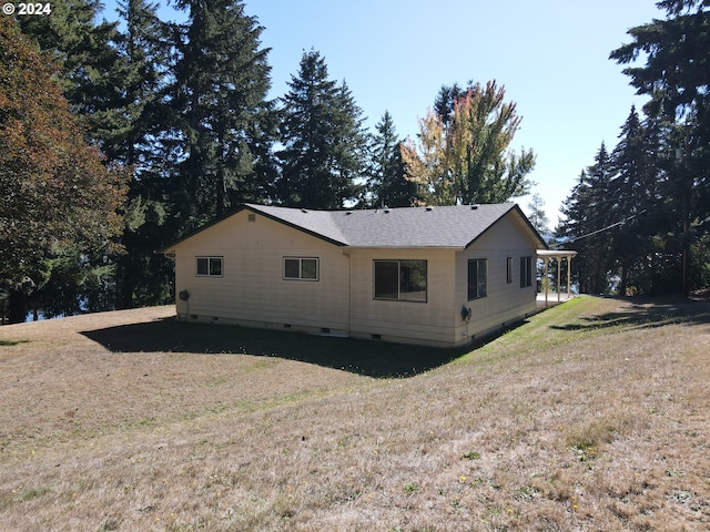 back of house with a yard