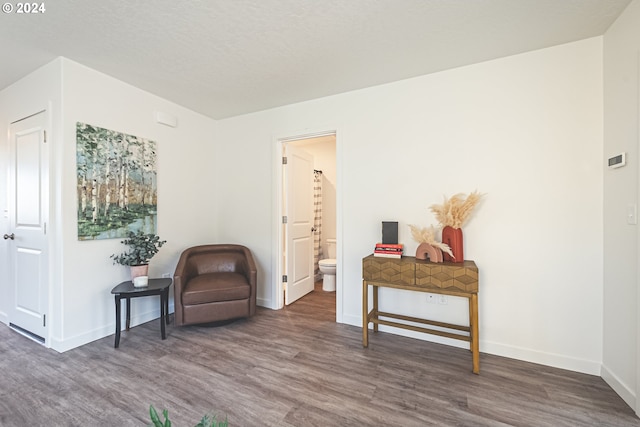 living area with dark hardwood / wood-style flooring