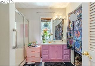 bathroom with vanity and an enclosed shower