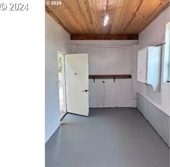 spare room featuring wooden ceiling