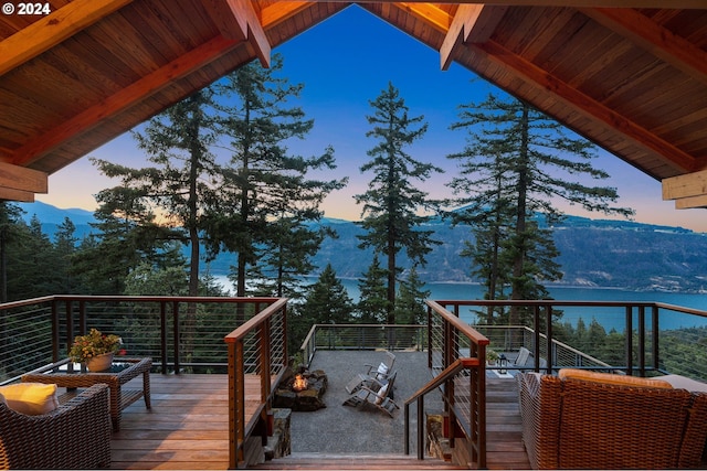 wooden deck featuring a mountain view