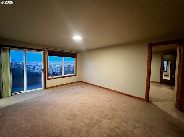 empty room featuring light carpet and a mountain view