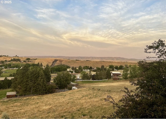 mountain view featuring a rural view