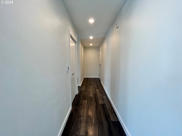 hallway with dark hardwood / wood-style floors