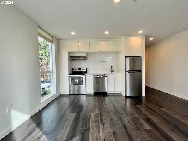 kitchen with sink, white cabinets, stainless steel appliances, and dark hardwood / wood-style flooring