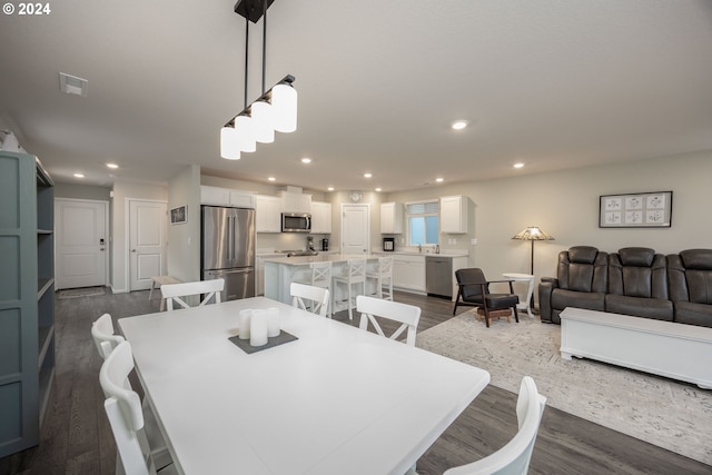 dining room featuring dark hardwood / wood-style flooring and sink