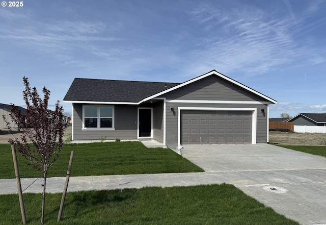 152 SW Eagle Dr, Boardman, OR 97818 - ranch-style house with concrete driveway, an attached garage, and a shingled roof