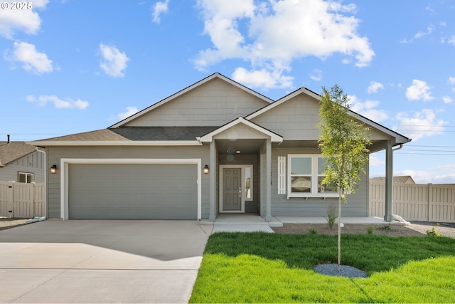 view of front of house featuring a front yard and a garage