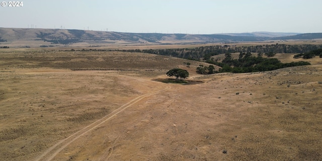 property view of mountains featuring a rural view