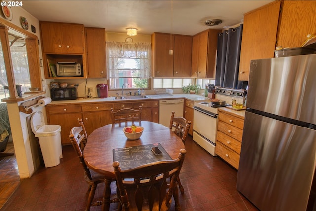 kitchen featuring sink and white appliances