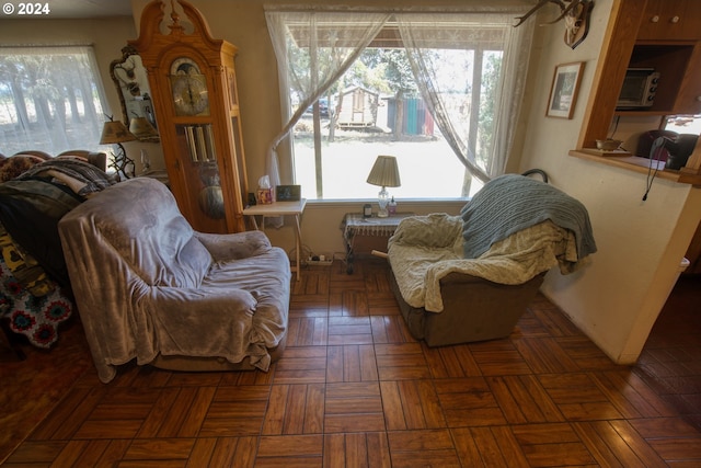 living area featuring dark parquet floors