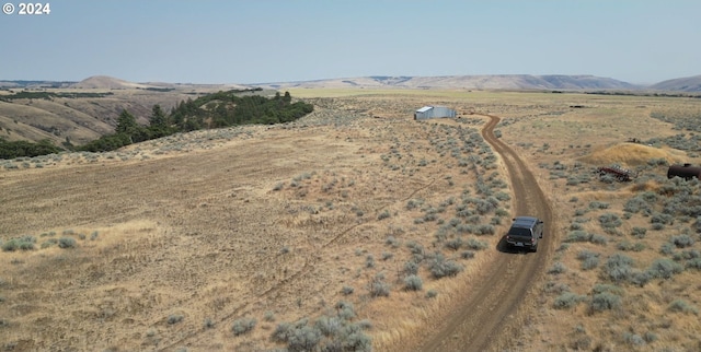 bird's eye view with a mountain view and a rural view