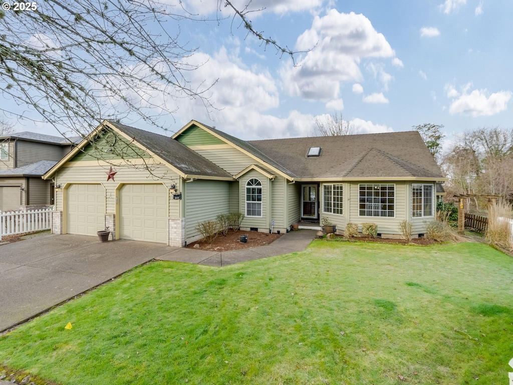 ranch-style house with a garage and a front yard