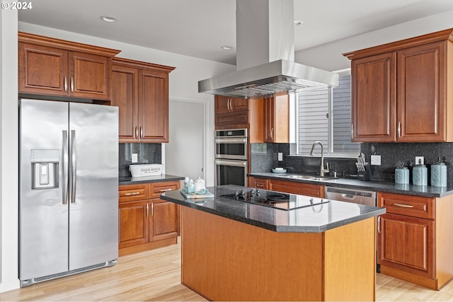 kitchen with a kitchen island, island exhaust hood, appliances with stainless steel finishes, and tasteful backsplash