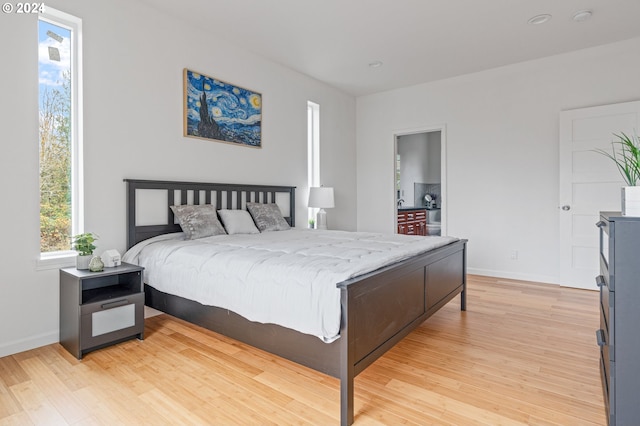 bedroom with light hardwood / wood-style floors