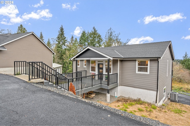 view of front of home with central air condition unit and covered porch