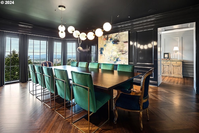 dining room with dark parquet flooring and crown molding