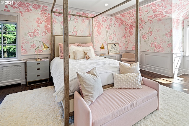 bedroom featuring dark hardwood / wood-style floors and ornamental molding