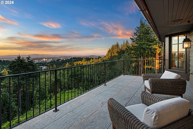 view of balcony at dusk