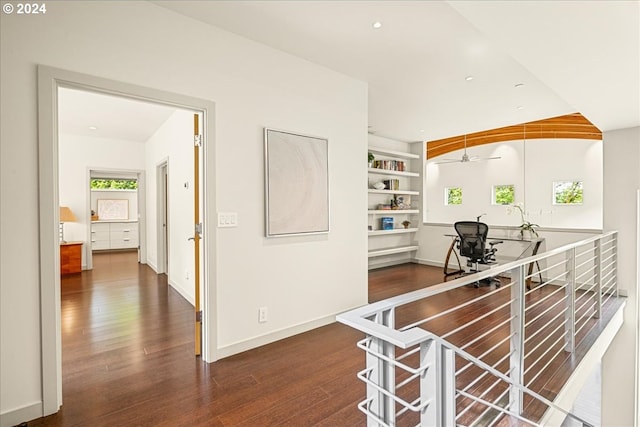 kitchen with ceiling fan, dark hardwood / wood-style flooring, and built in features