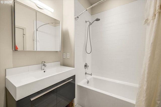 bathroom with shower / bath combo and vanity