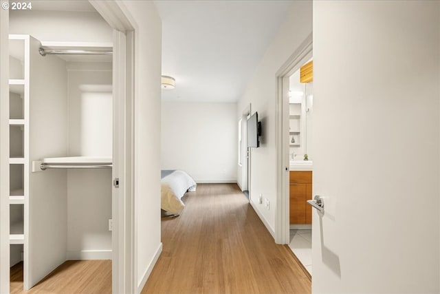 corridor featuring light hardwood / wood-style flooring