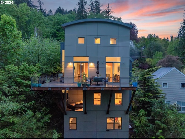 view of front of house featuring a balcony