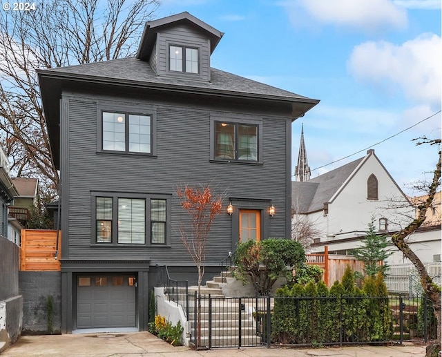 view of front of property featuring a garage