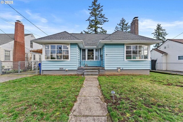 bungalow with a carport and a front yard