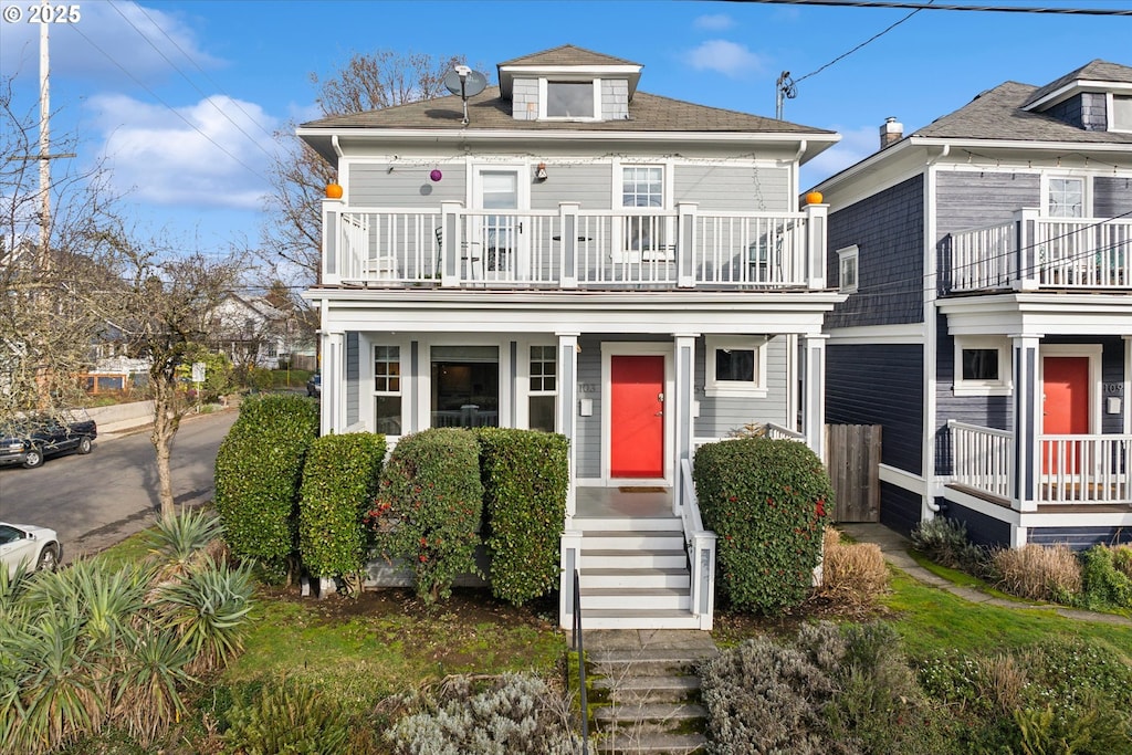 view of front of house with a balcony