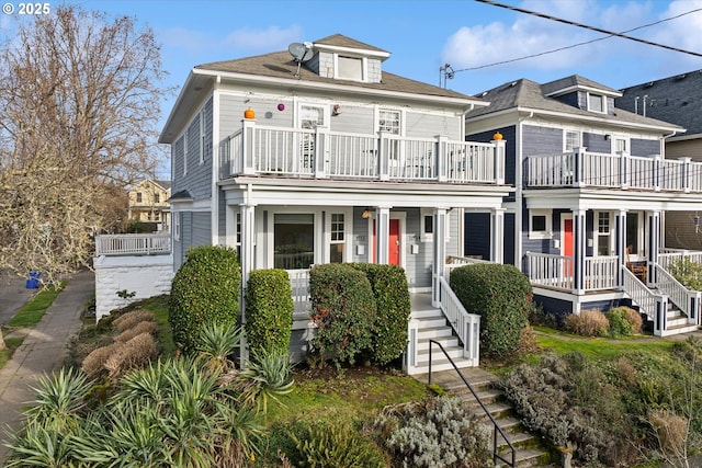 view of front of house with covered porch and a balcony