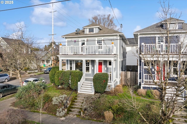 view of front of house featuring a balcony