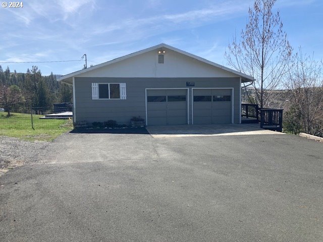 view of side of home with a garage